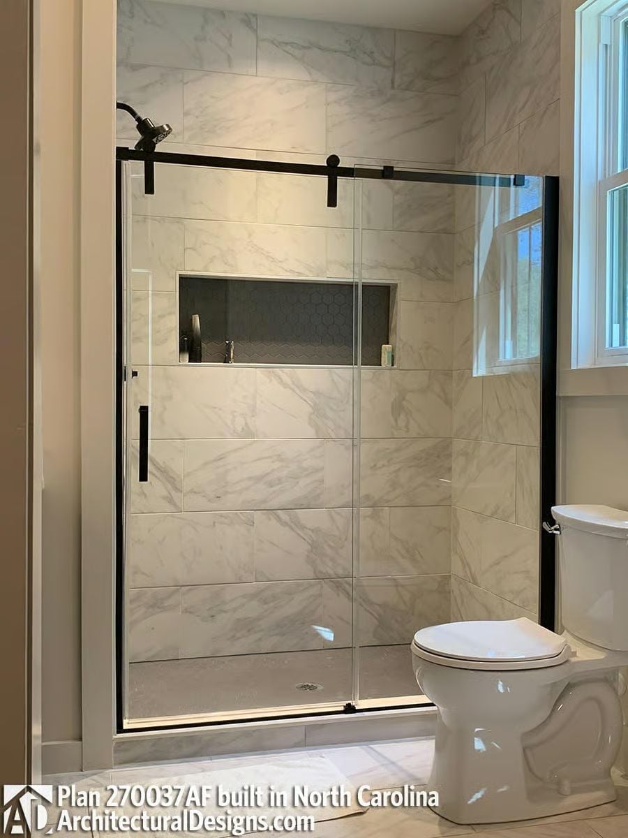 Barn-Style Hardware and Marble-Look Tile That Justify the Upgrade