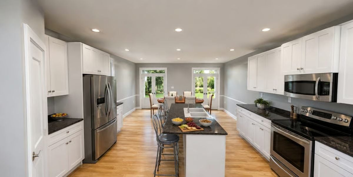 Granite Counters, Bar Stools for Two, and French Doors That Beg to Stay Open