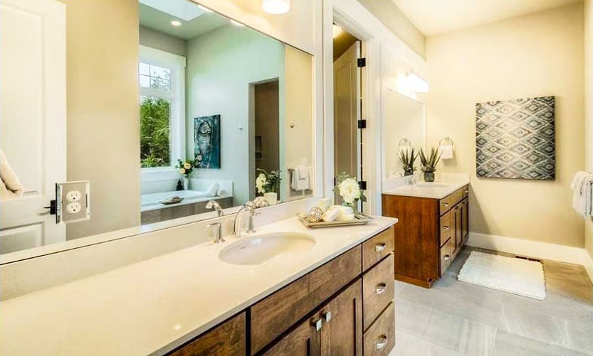 Dual Vanities Separated by a Doorway Keep Morning Routines From Becoming a Negotiation
