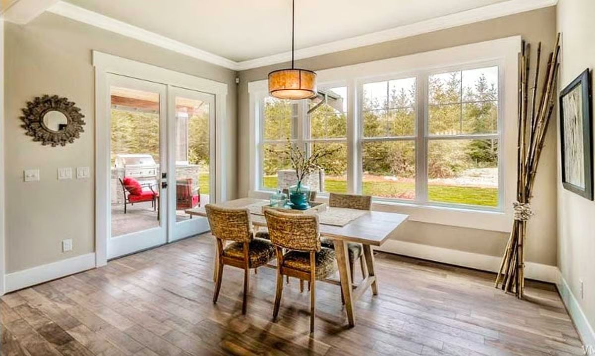 Woven Chairs and a Teal Vase Pull Natural Texture Into the Dining Nook