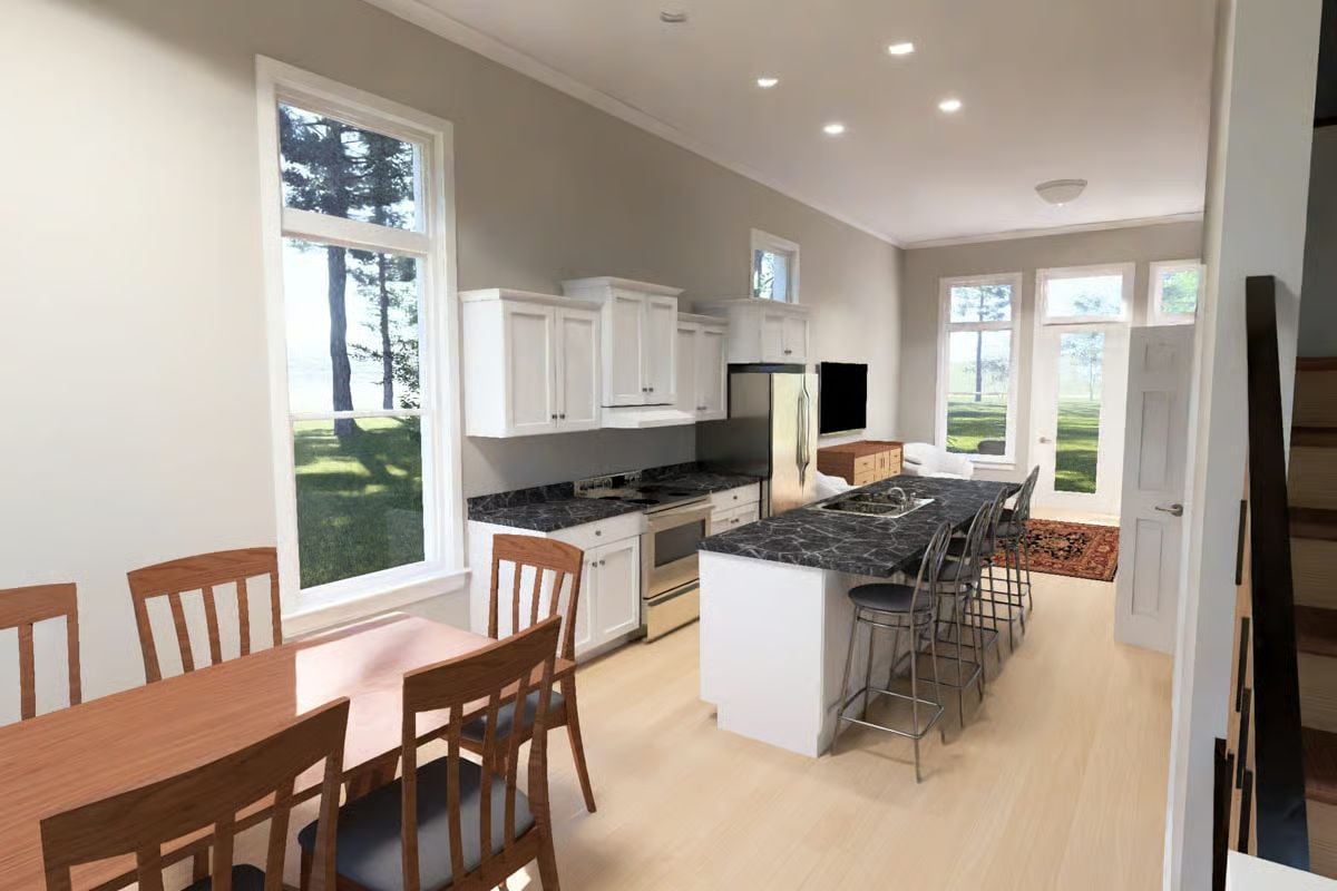 Dark Countertops, White Cabinets, and a Island Long Enough to Mean Business