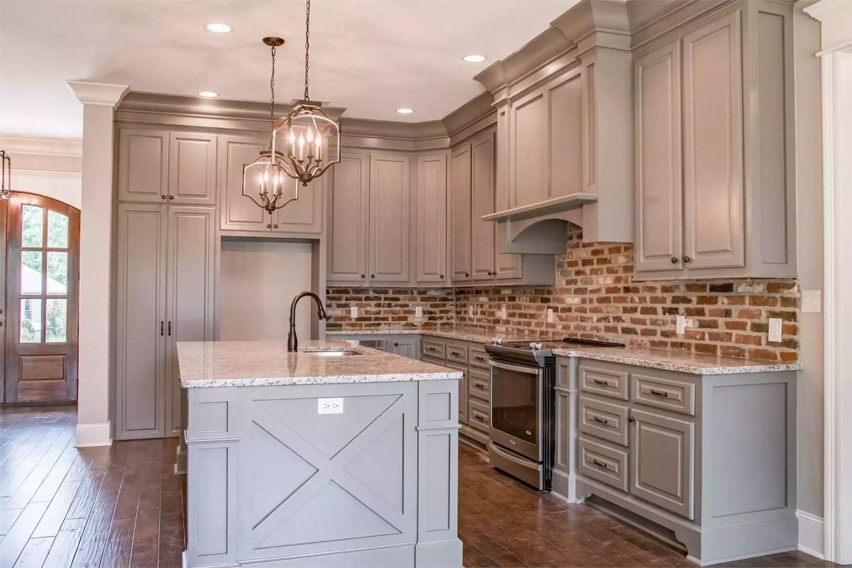 Brick Backsplash and Cross-Panel Island Give This Kitchen Real Personality