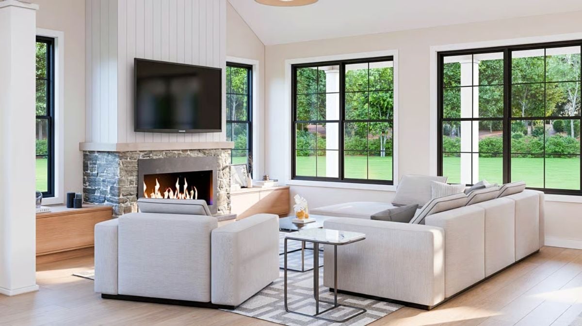 Stone Fireplace, Black Windows, and a Sectional That Knows Its Job