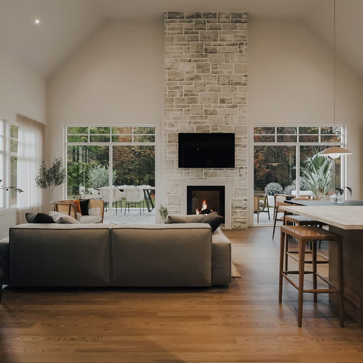 Stone Chimney Tower and Vaulted Ceiling Give This Great Room Serious Presence