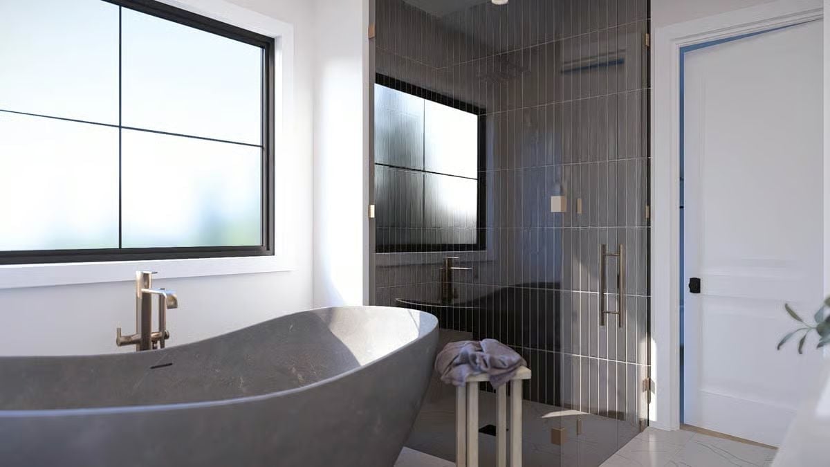 Dark Tile, Freestanding Stone Tub, and a Shower That Means Business