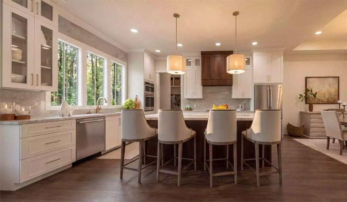 Drum Pendants and a Dark Wood Island Make This Kitchen Worth Lingering In