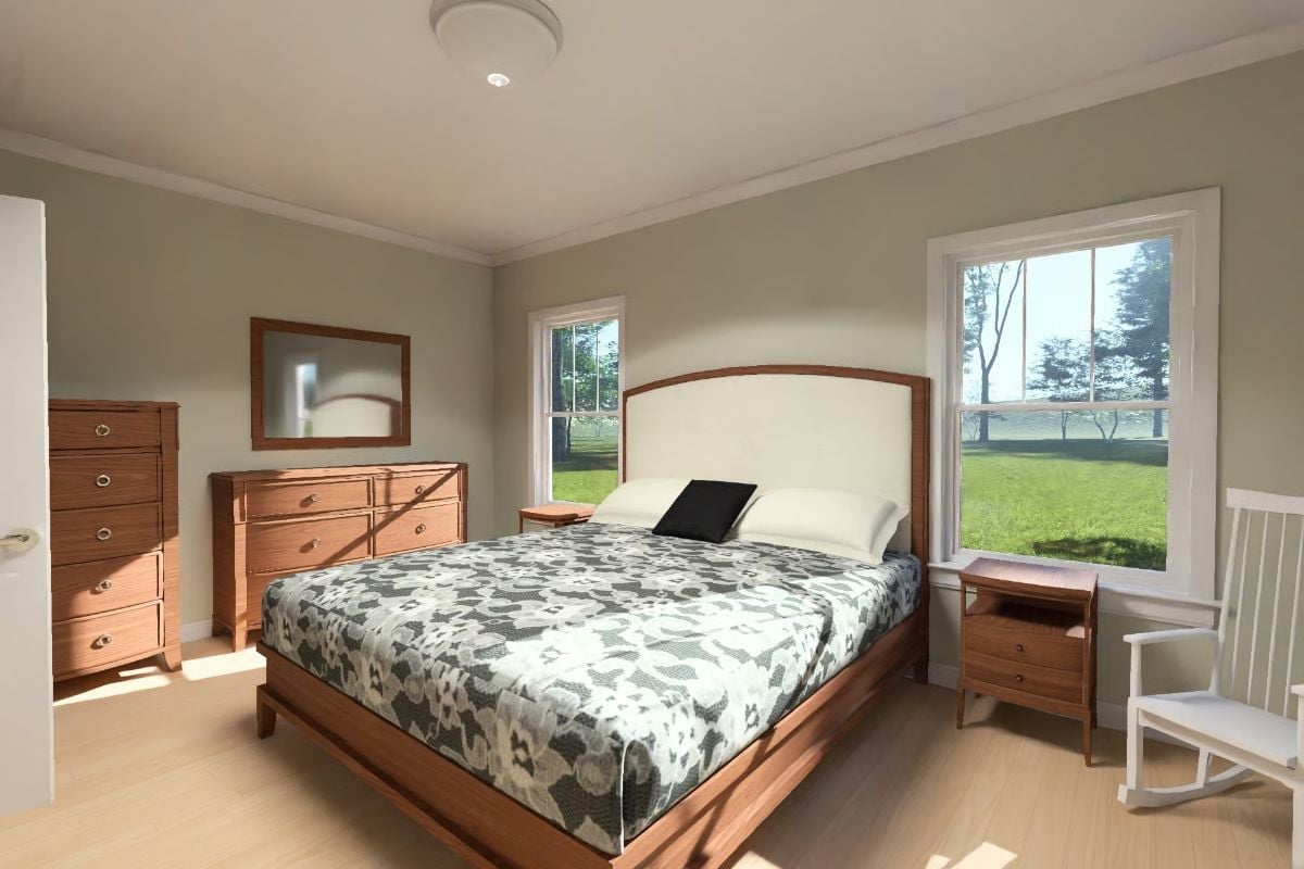 Walnut Bed Frame and Floral Quilt in a Room That Doesn't Try Too Hard