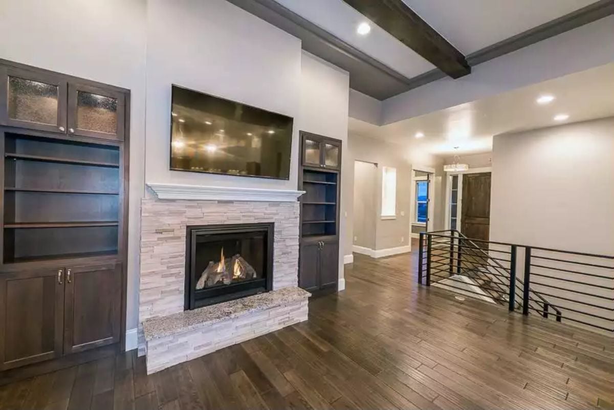 Stacked Stone Fireplace Wall with Built-Ins That Actually Hold Things