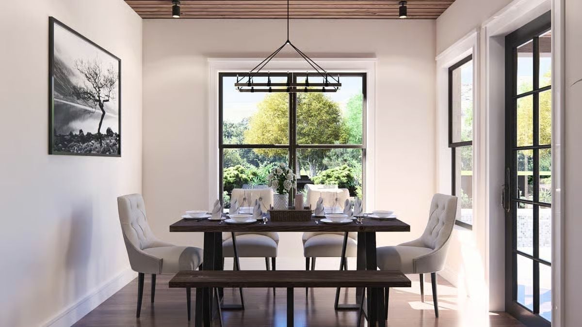 Dark Wood, Tufted Chairs, and a Window That Does All the Work
