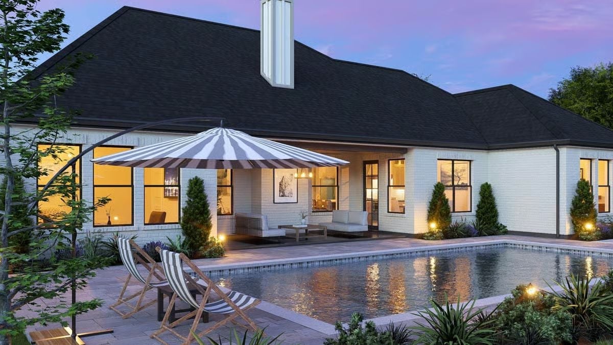 Striped Umbrella, Pool Lights, and a Patio Built for Staying Out Past Dark