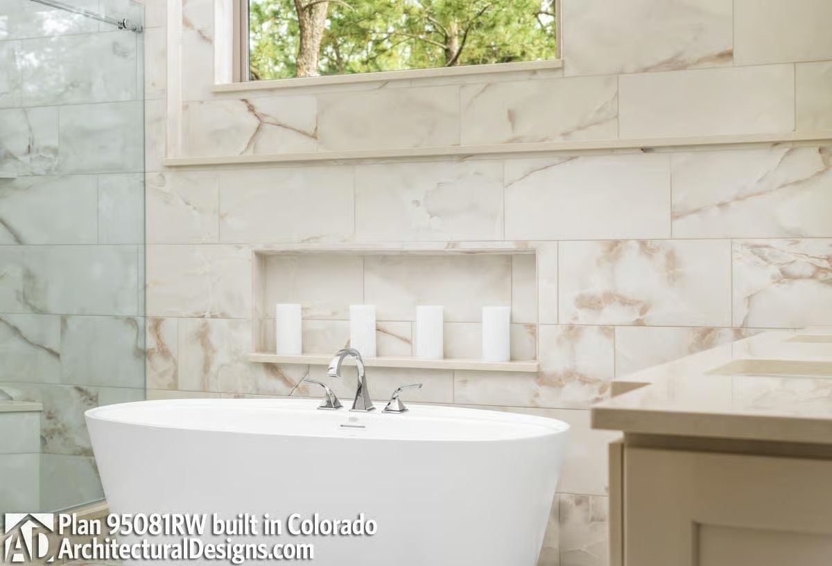Marble Wall Niche and Freestanding Tub Make a Quiet Argument for Staying In