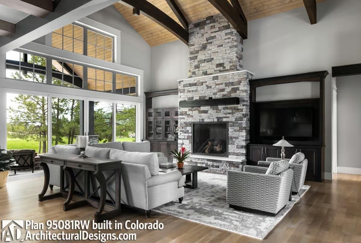 Stone Fireplace Runs Floor to Vaulted Ceiling Without Apology