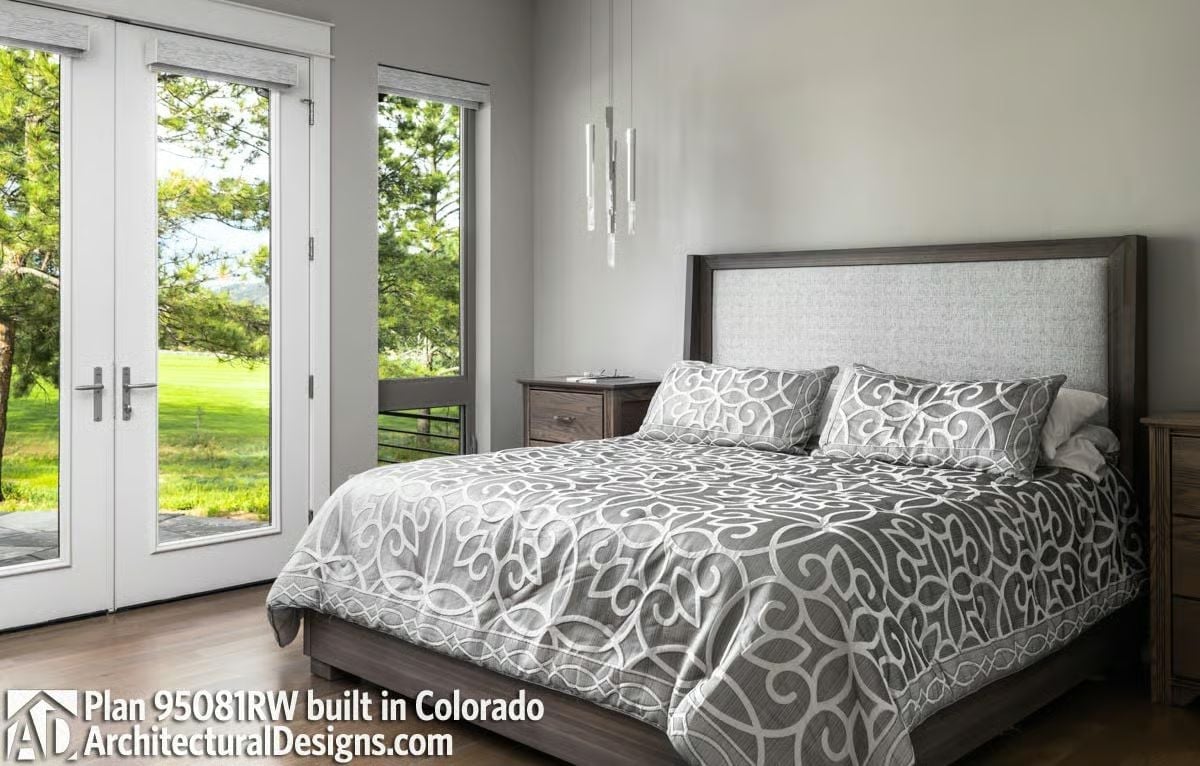 Upholstered Headboard and Patterned Bedding Pull a Colorado Bedroom Into Focus