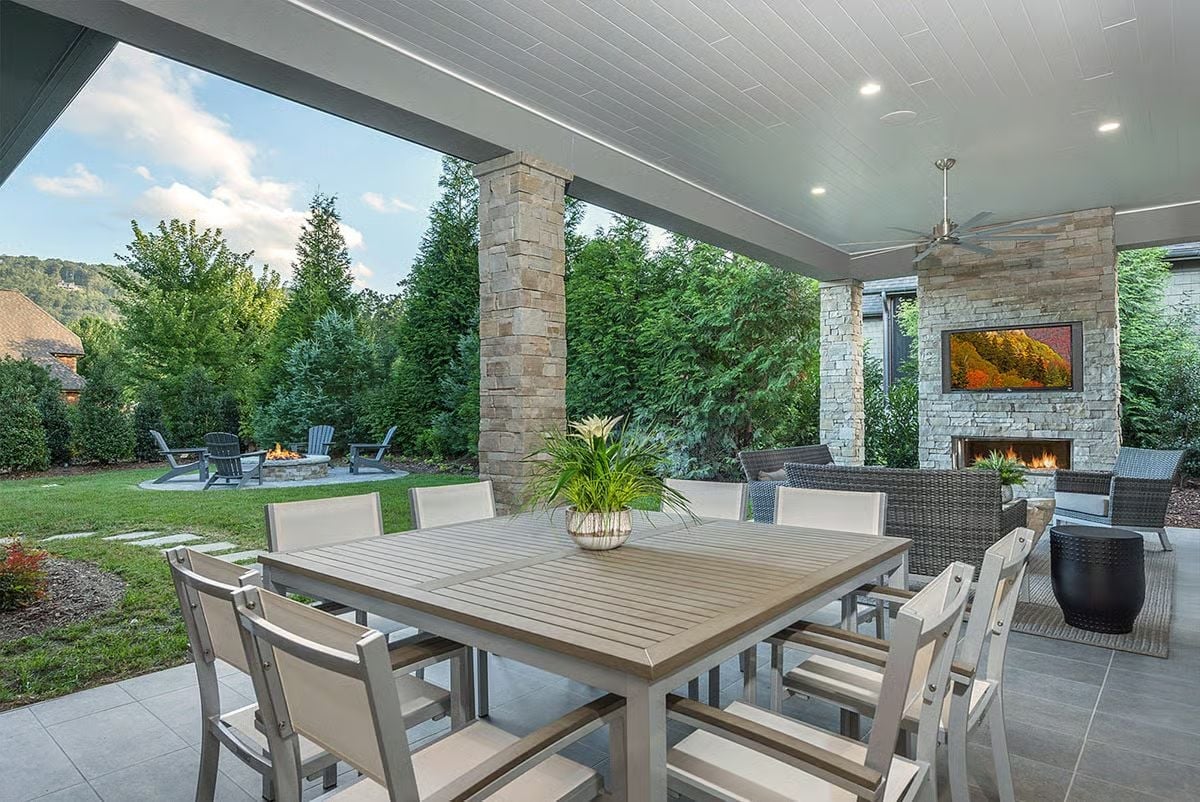 Covered Lanai Where the Dining Table and the Fireplace Both Pull Equal Weight