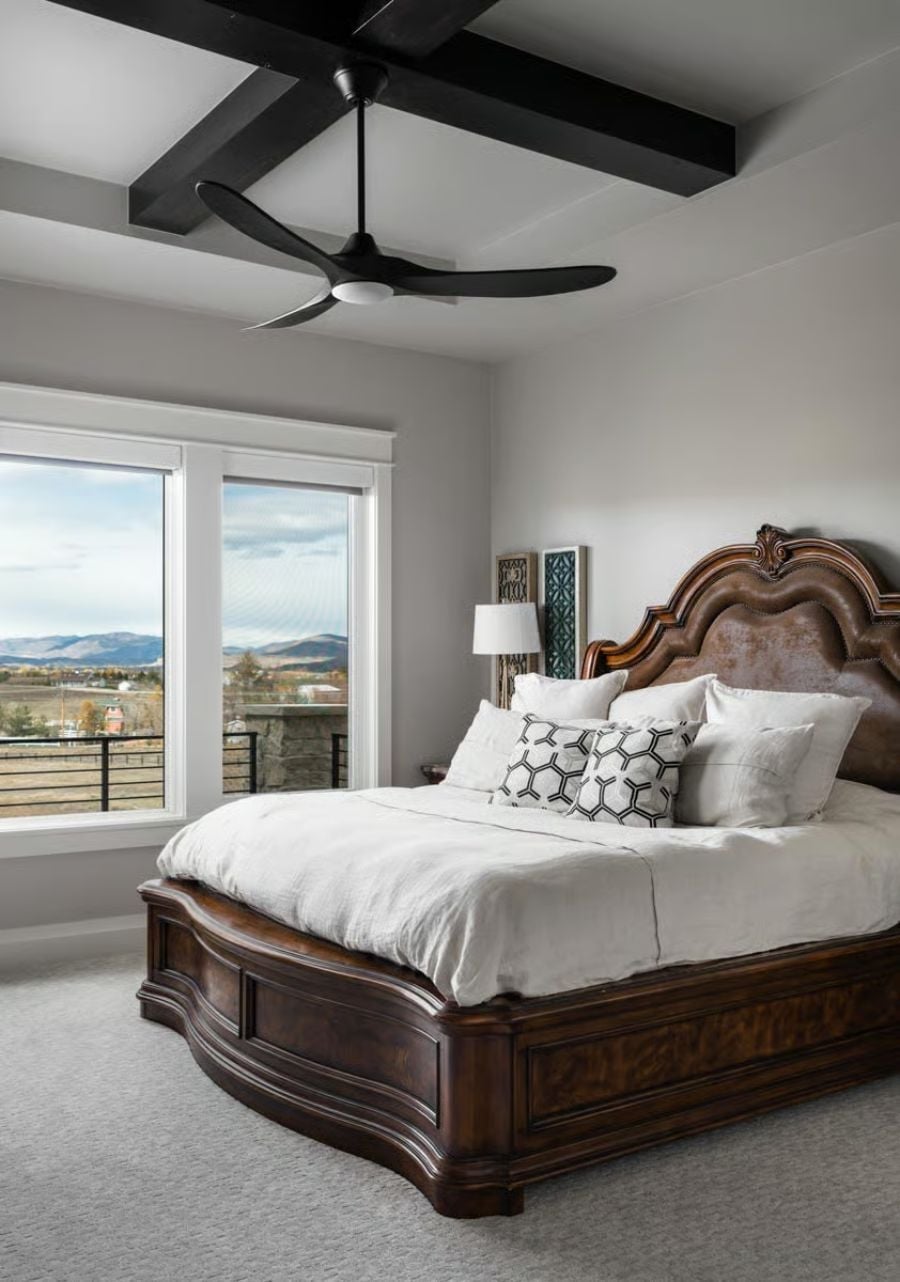 Carved Walnut Headboard, Exposed Beams, and Mountains Framed Like a Painting