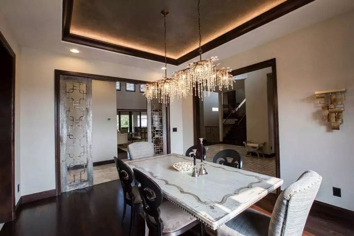 Crystal Chandelier and Pocket Doors That Pull the Room Together