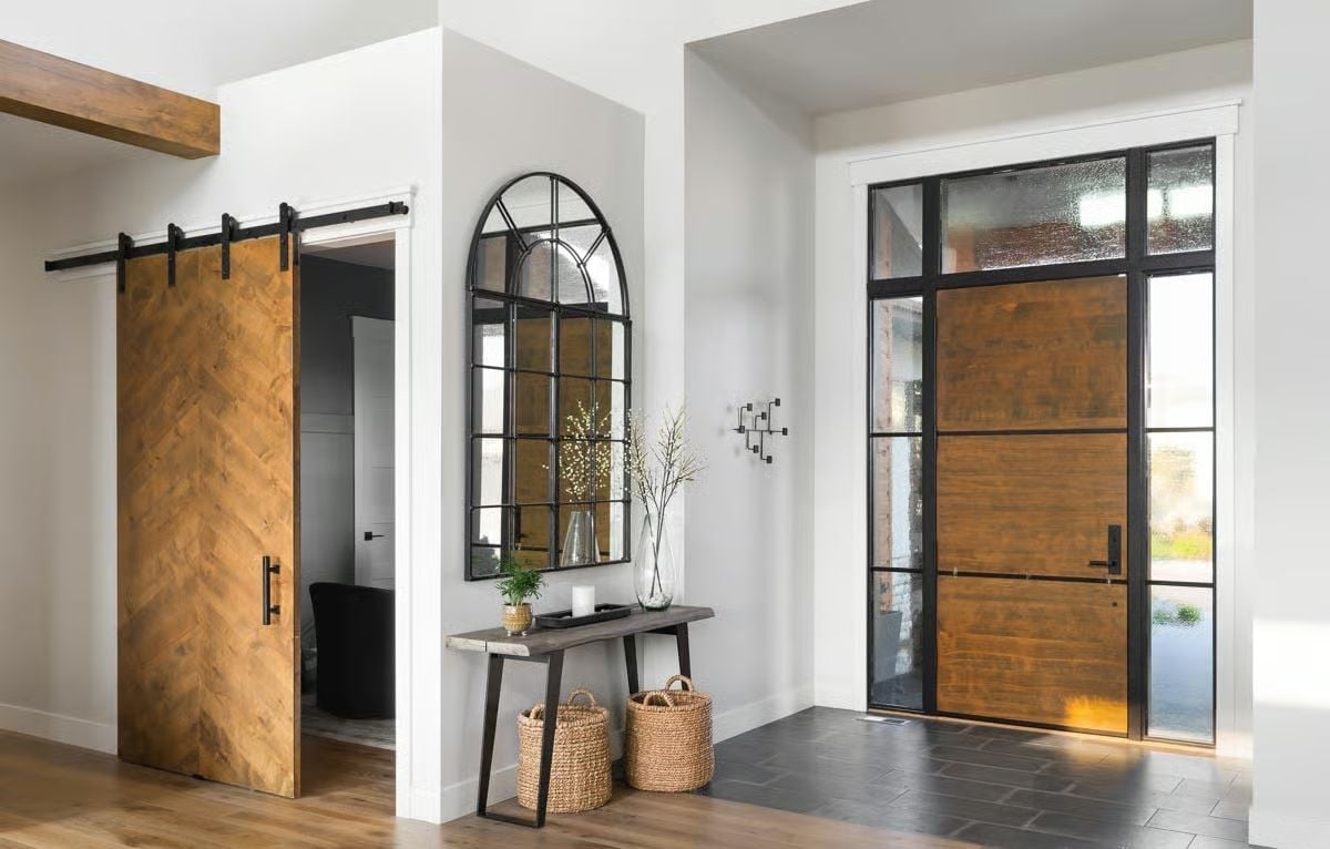 Herringbone Barn Door and Black-Framed Entry Set the Tone Before You're Inside