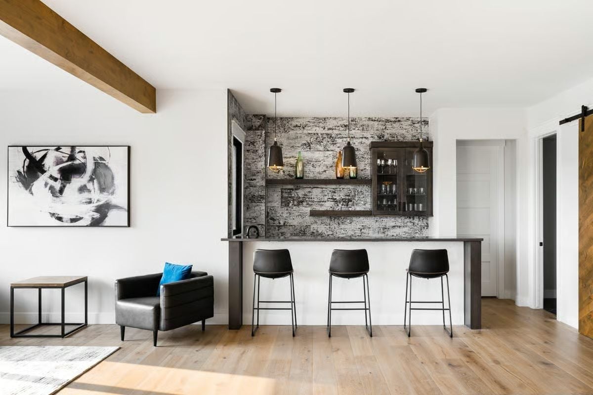Pendant Lights, Leather Stools, and a Bar Wall That Pulls Its Own Weight