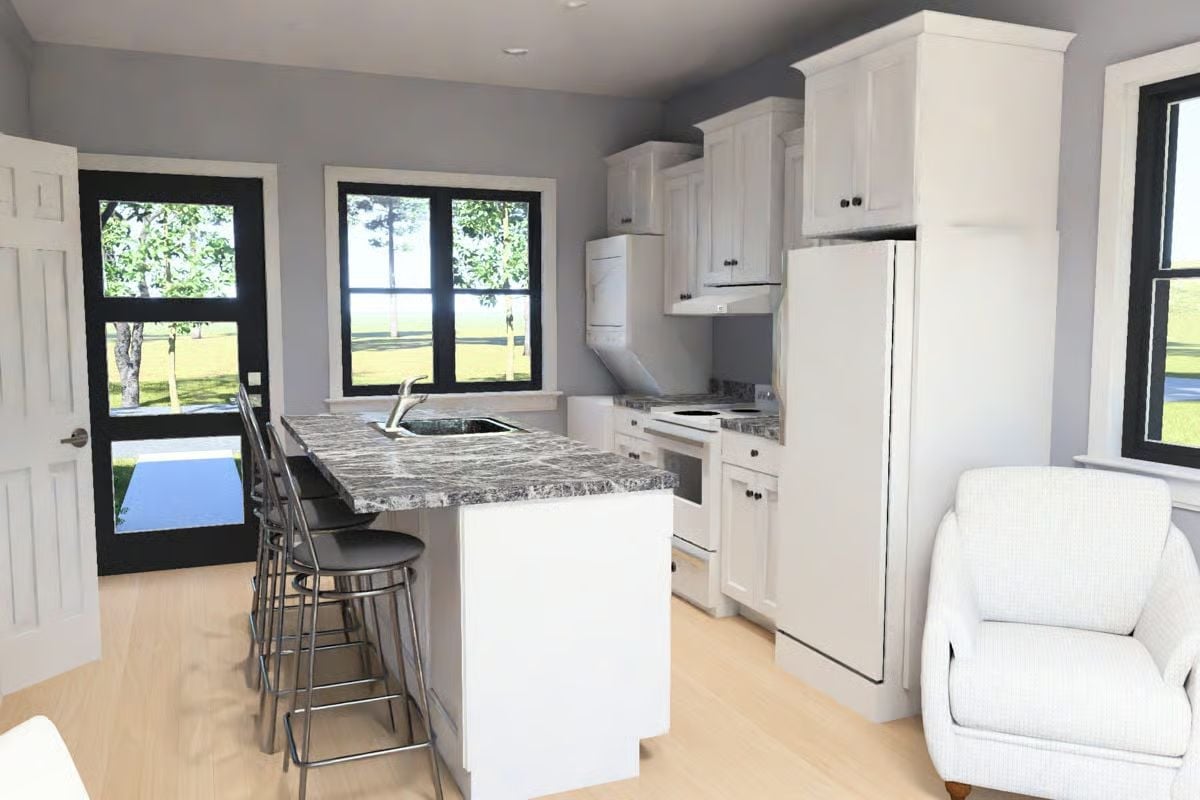 Granite Island with a Sink Is Doing More Work Than the Rest of the Kitchen Combined