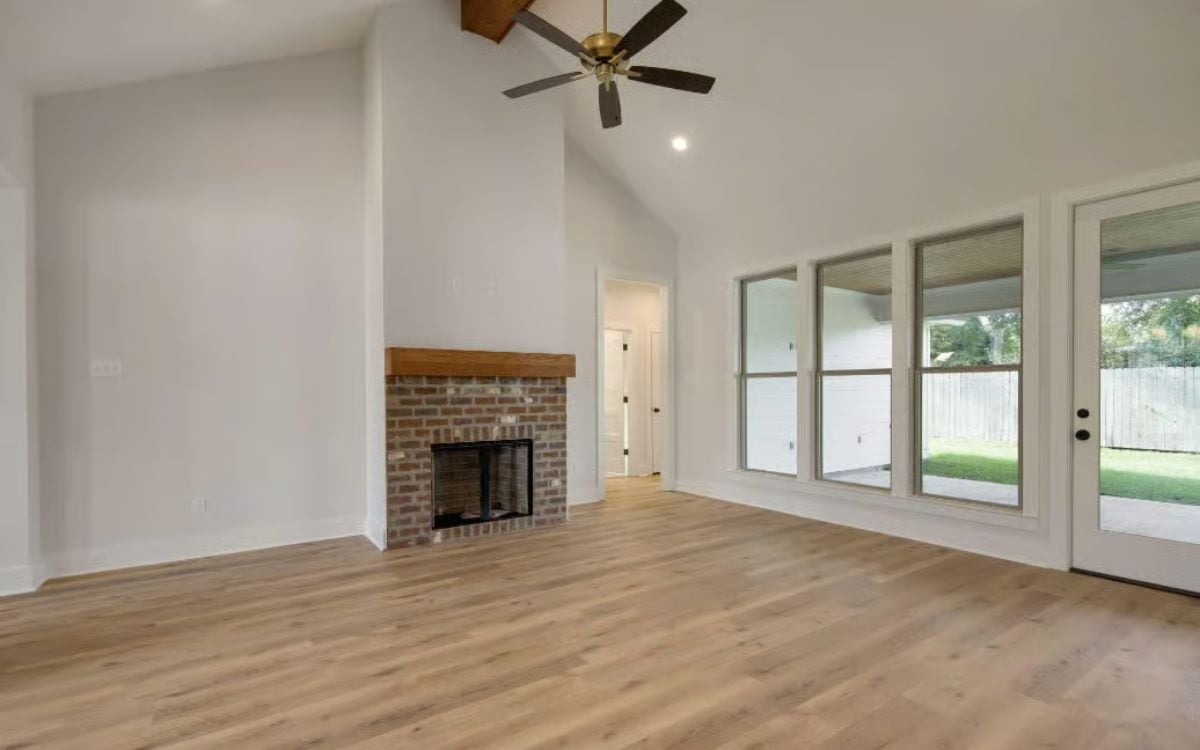 Vaulted Ceiling, Wood Mantel, Real Brick: Living Room That Earns Its Square Footage