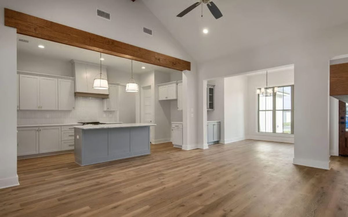 White Cabinets, Wood Beam, Gray Island: Kitchen Built to Actually Work
