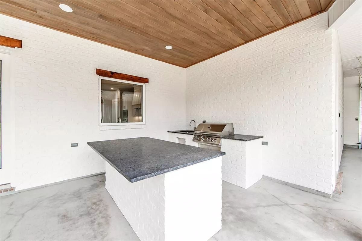 Painted Brick and Polished Concrete Give This Outdoor Kitchen Real Staying Power