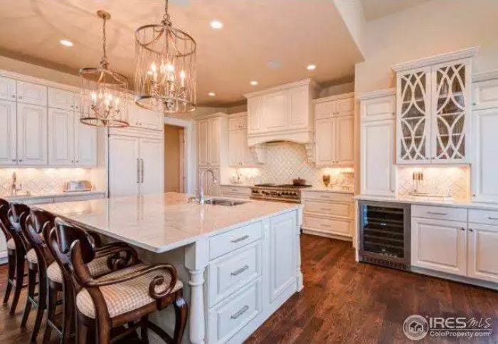 Chandeliers, Marble Counters, and a Wine Fridge That Makes Entertaining Feel Effortless