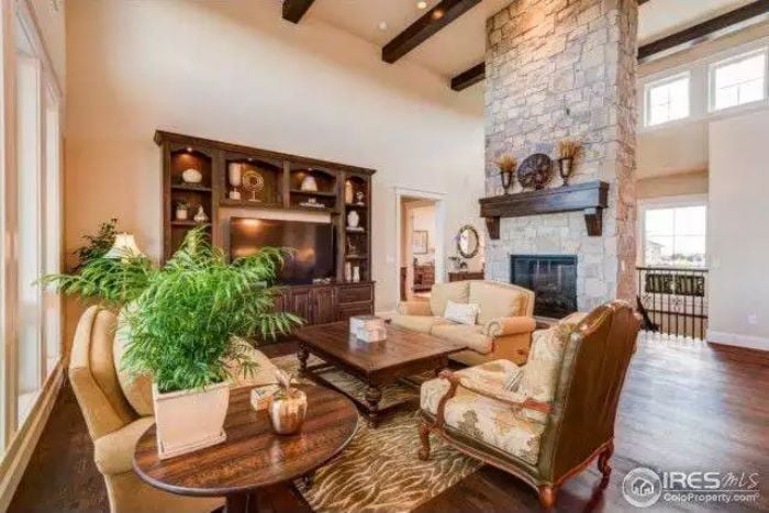 Stone Fireplace, Exposed Beams, and Ceilings Tall Enough to Humble You