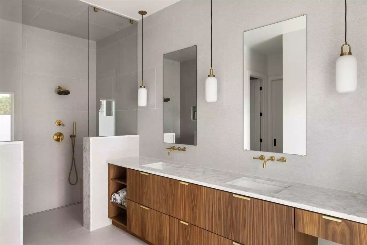 Brushed Brass and Walnut Make a Strong Case for Skipping the All-White Bathroom