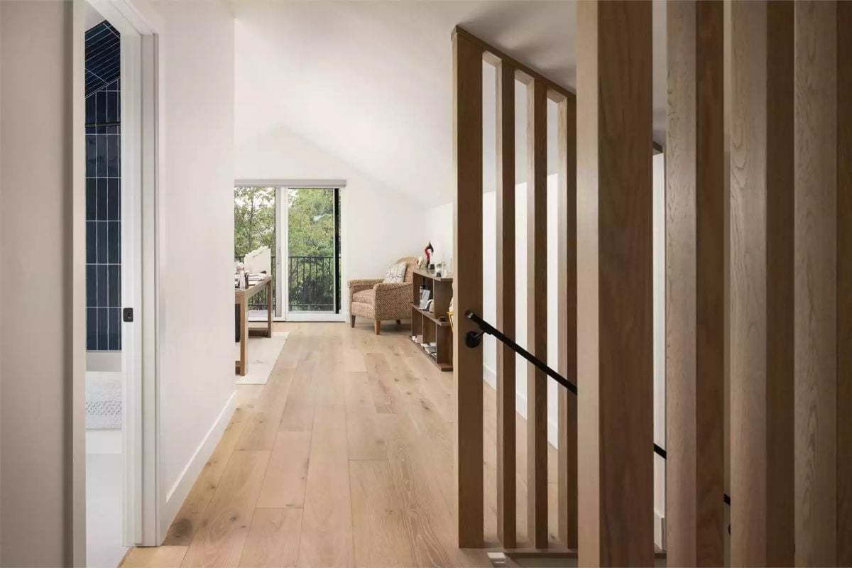 Slatted Oak Partition Earns Its Place Between the Hallway and the Stair