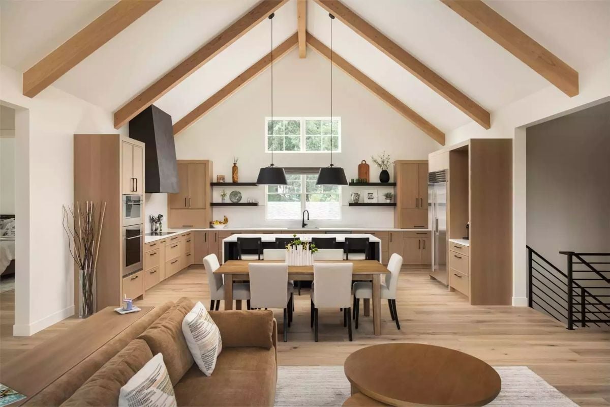 Vaulted Ceilings and Warm Oak Cabinets Pull the Open Plan Together