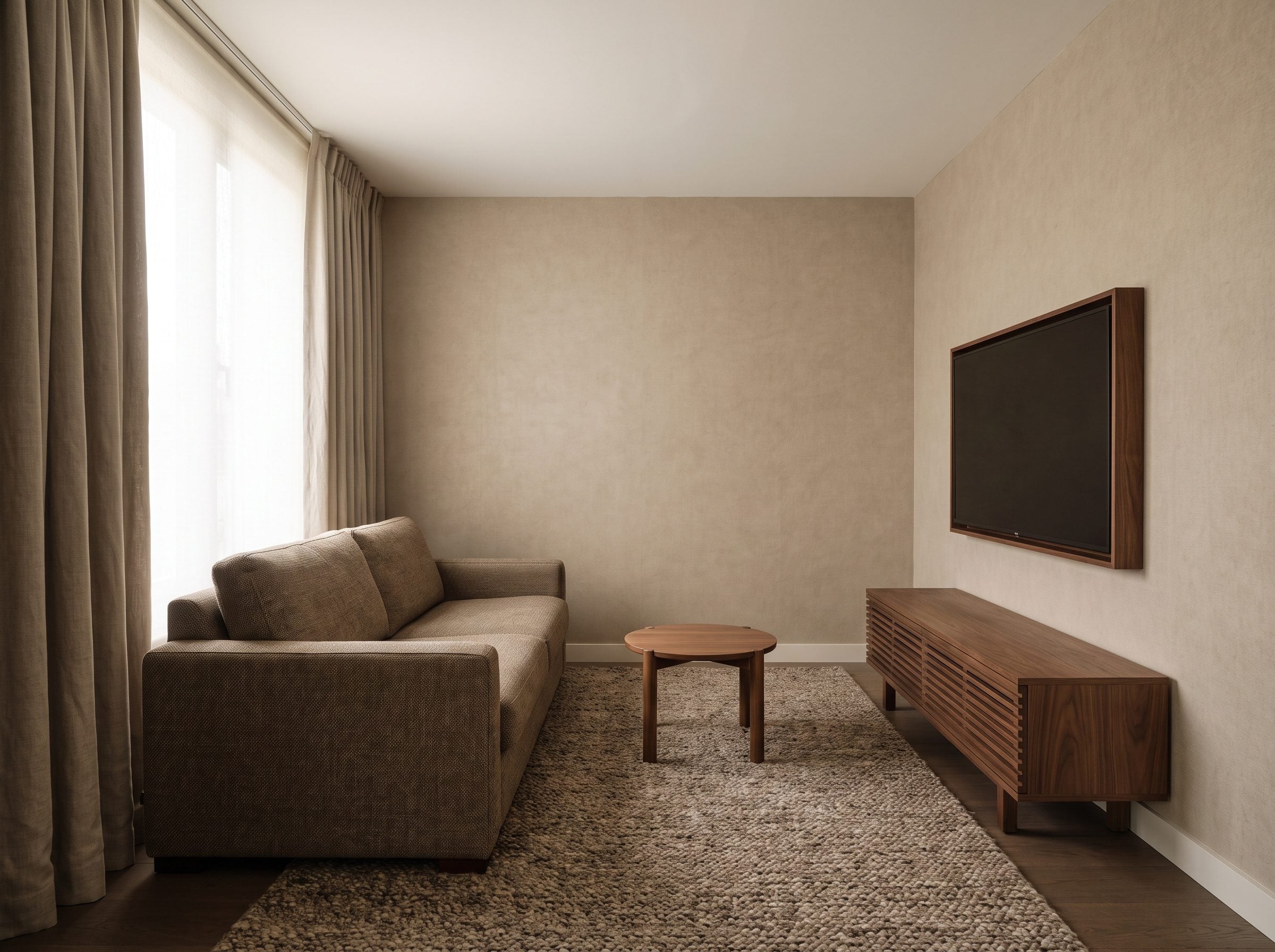 Nine-by-eleven-foot TV room with a linen sofa flat against the rear wall about six feet from a wall-mounted 55-inch