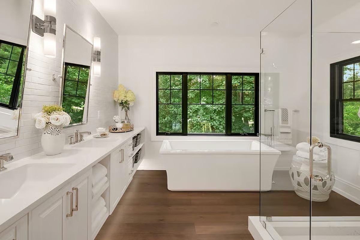 Freestanding Soaker Tub Centered on a Window That Does All the Work
