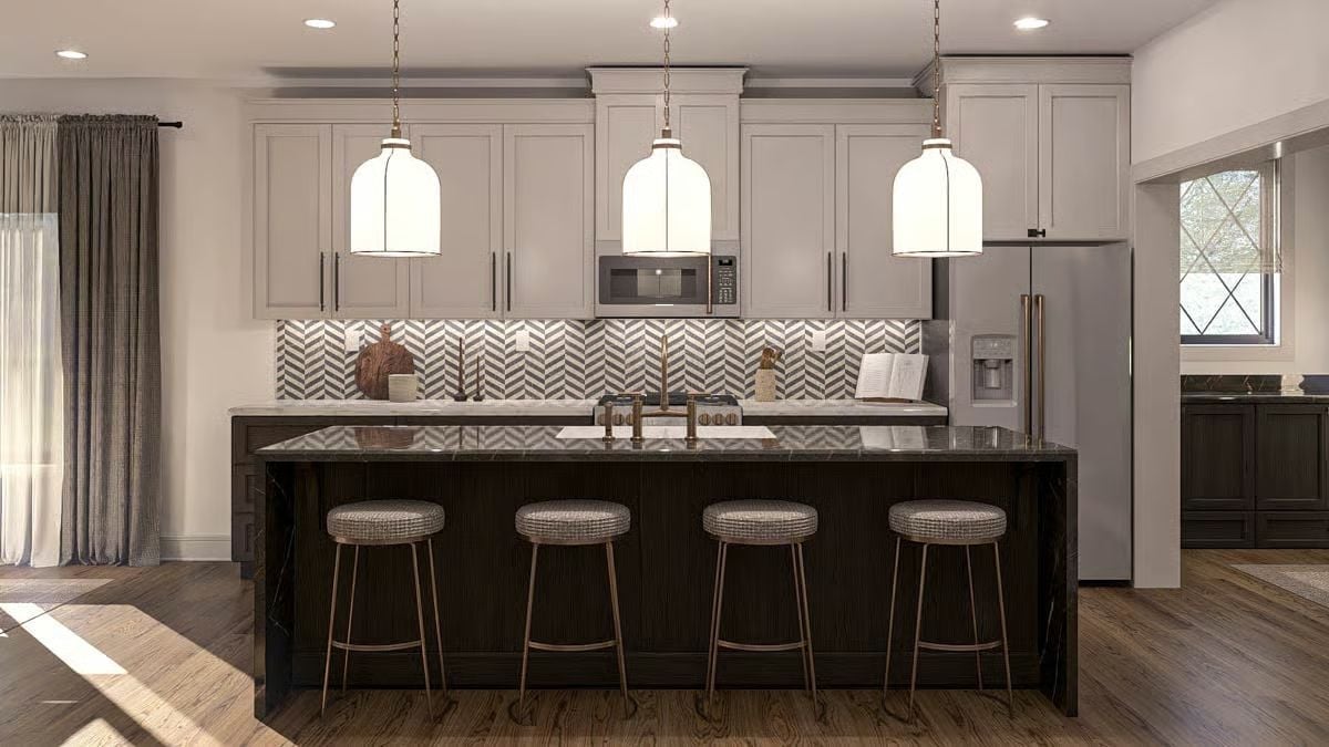 Dark Marble Island, Brass Fixtures, and Four Stools That Mean Business