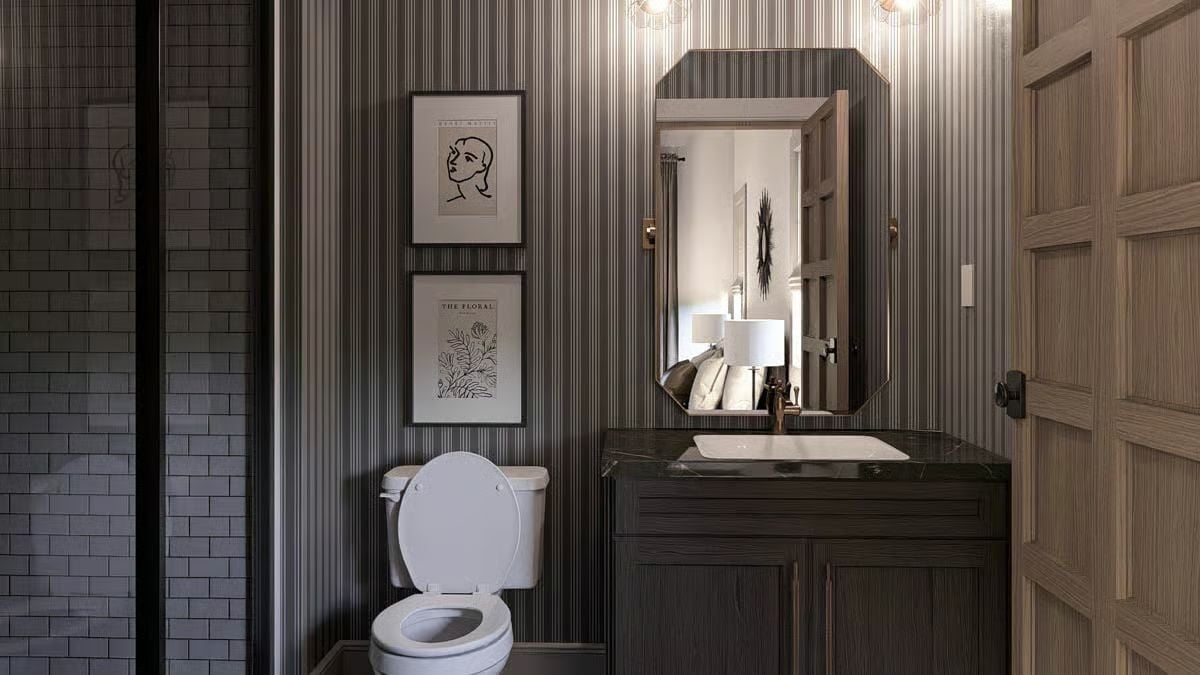 Striped Wallpaper, Black Marble Vanity, and Art That Takes the Powder Room Seriously