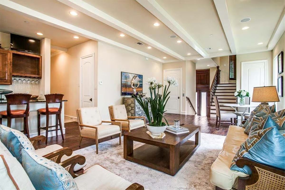 Cream Chairs, Blue Pillows, and a Bar Cart That Earns Its Place
