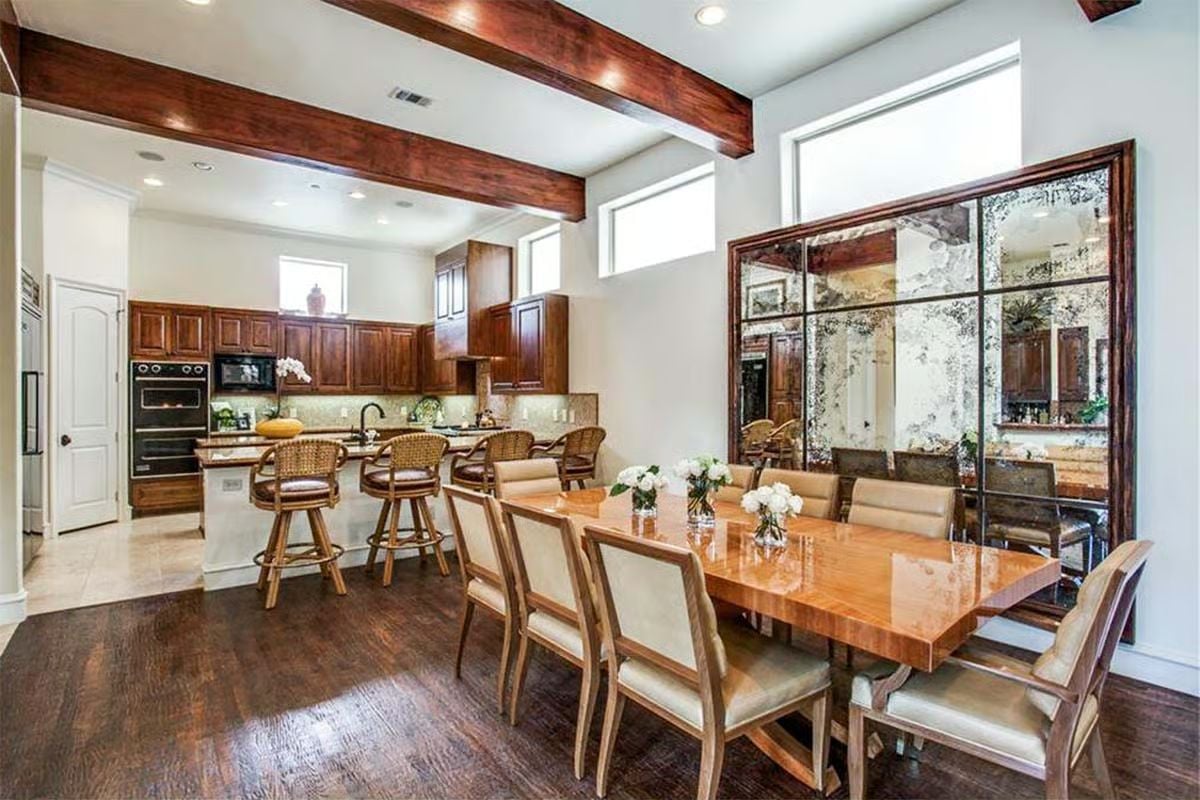 Dark Beams, Antique Mirror, and a Dining Table Built for Long Dinners