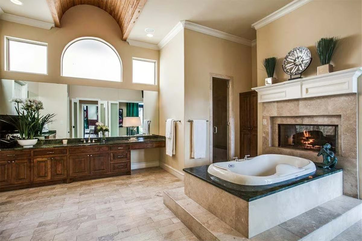 Soaking Tub Beside a Live Fire Is the Whole Point of Having a Master Bath