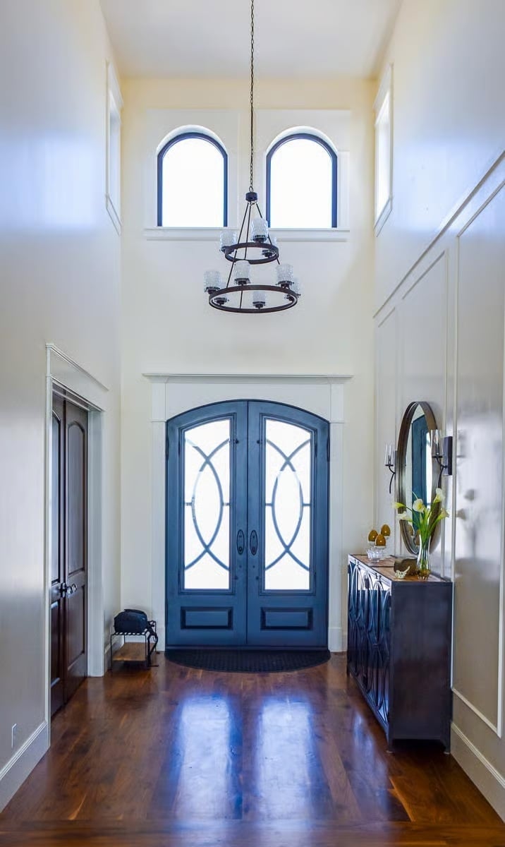 Arched Iron Entry Doors That Mean Business Before You're Even Inside