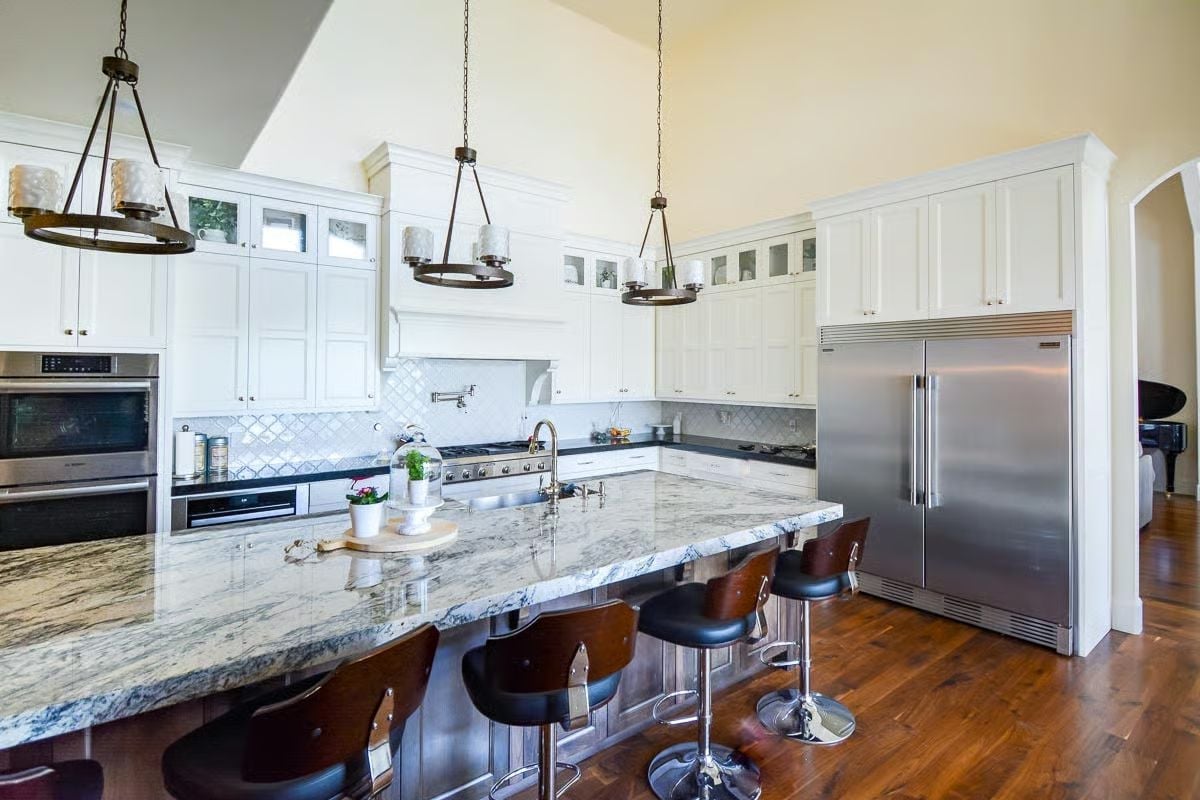 Marble Island Counter Stools and Pendant Lights That Earn Every Inch of Vertical Space