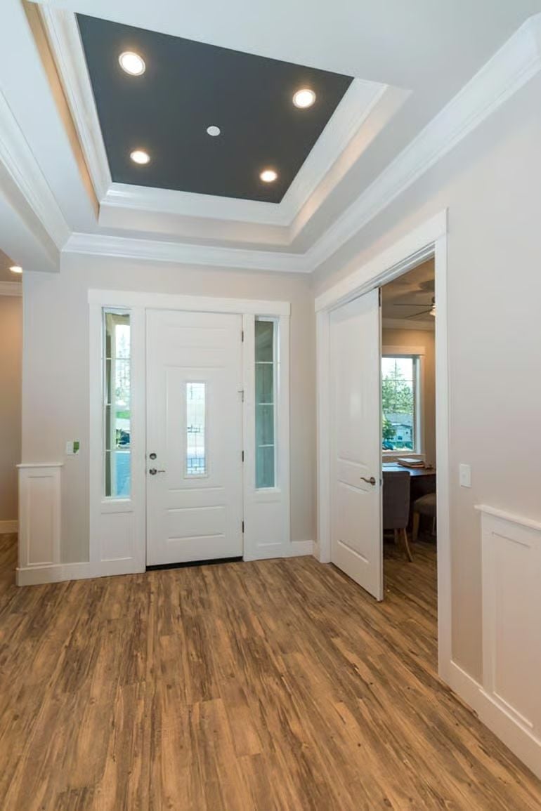Dark Tray Ceiling Makes the Foyer Feel Intentional, Not Just Functional