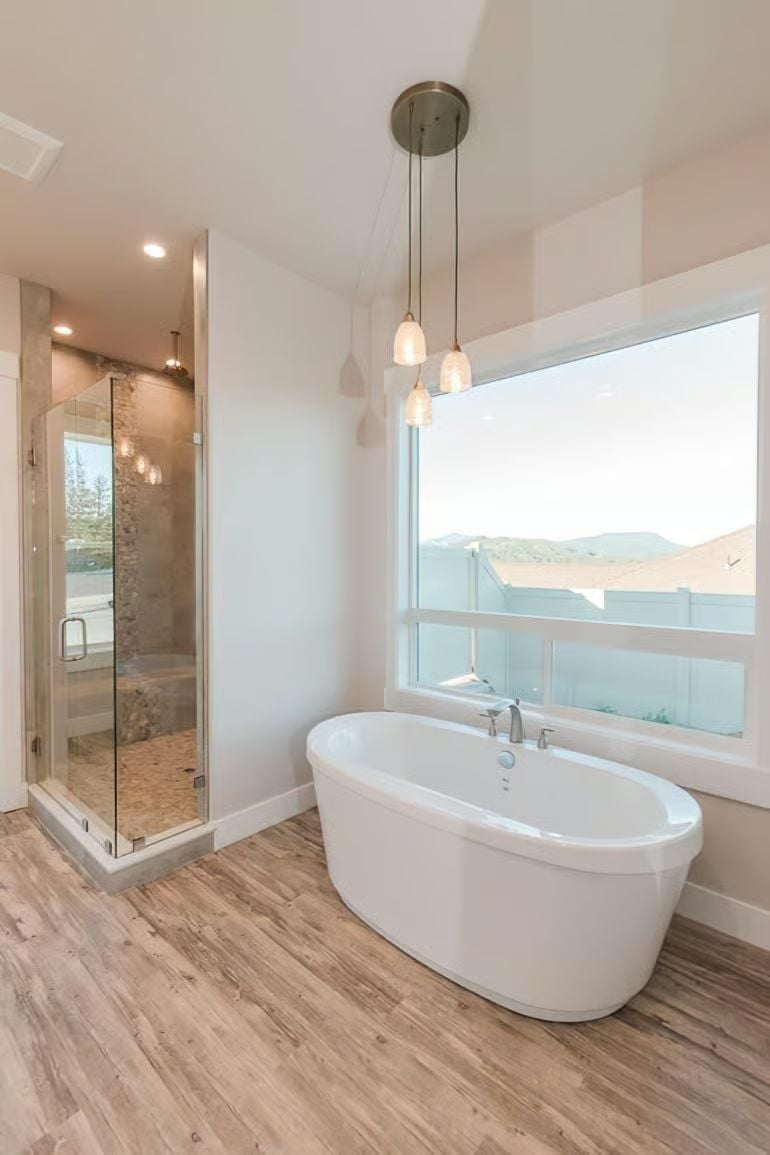 Freestanding Tub Positioned Under Pendant Lights Is a Decision You'll Notice Every Day