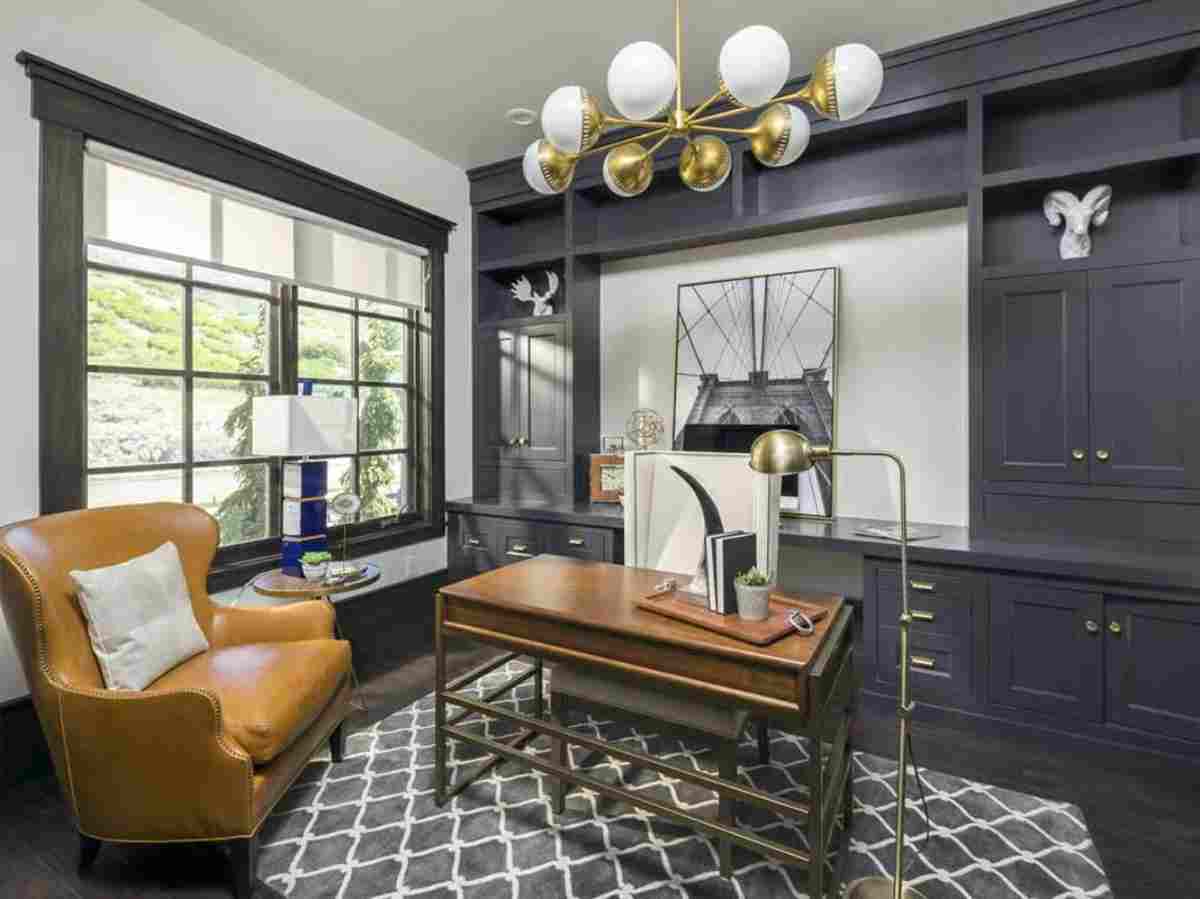 Navy Built-Ins and Brass Accents Make the Home Office Worth Lingering In