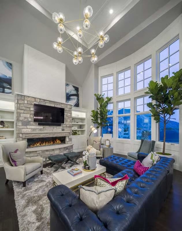 Sputnik Chandelier and Tufted Blue Leather Set the Tone Before Anyone Sits Down