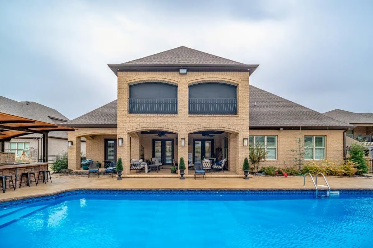 Blue Water, Stone Arches, and a Backyard That Justifies the Mortgage
