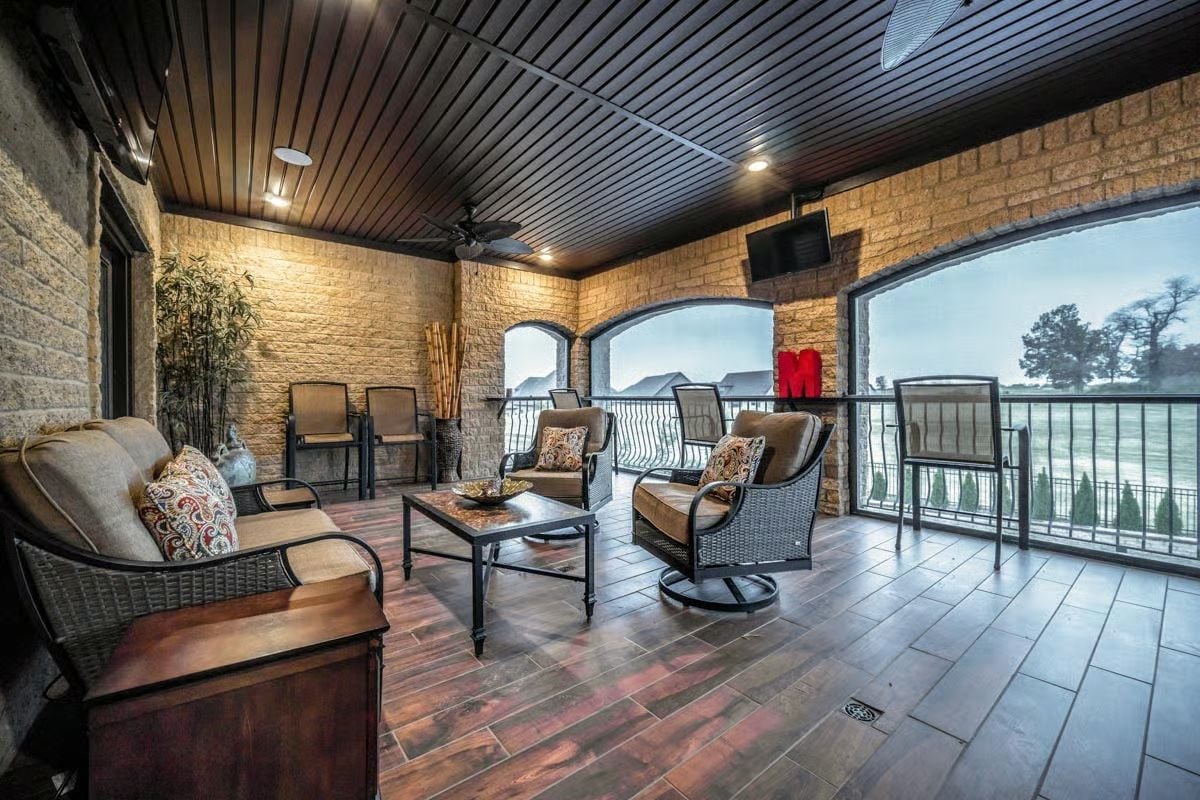 Covered Porch With Stone Arches and a View Worth Sitting Down For