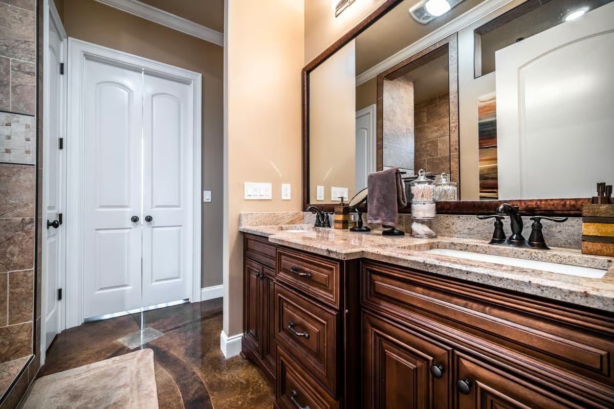 Dark Bronze Fixtures and Granite That Pull the Whole Vanity Together
