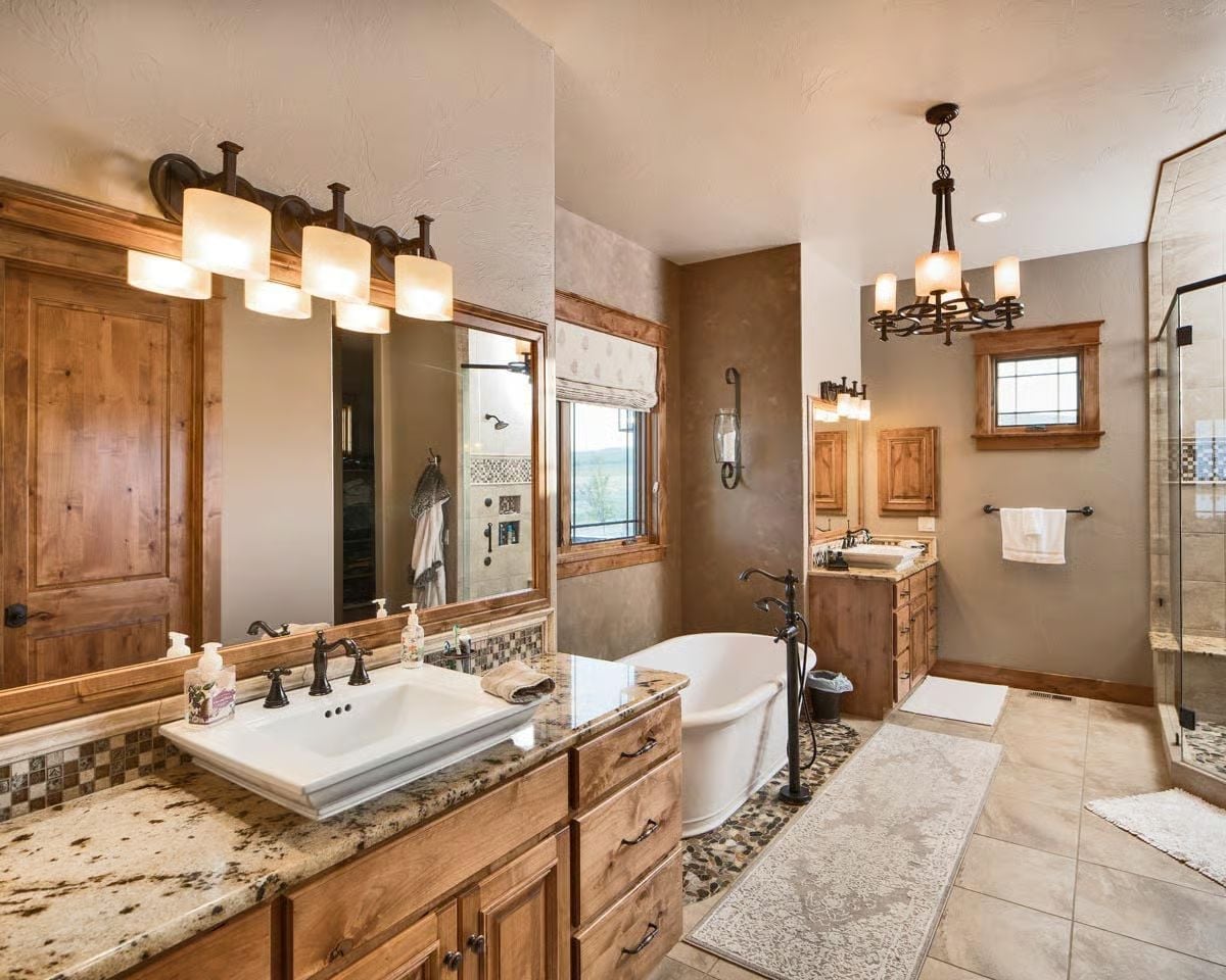 Freestanding Tub Anchored by Pebble Stone and Forged Iron Says You Earned This
