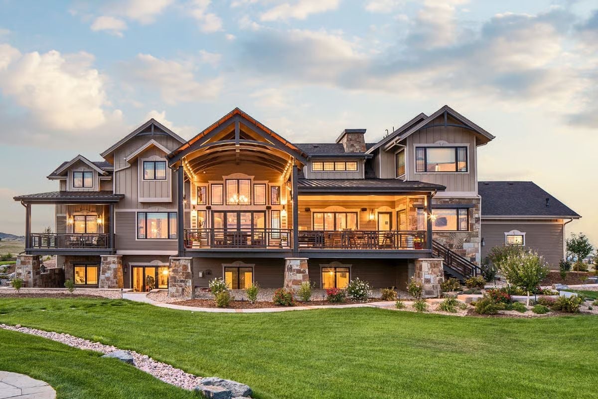 Warm Light Pours from Every Window at Dusk, and You Feel It from the Lawn