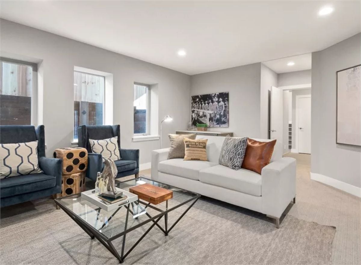 Navy Wingbacks and a White Sofa Pull Off a Pairing That Earns Its Keep